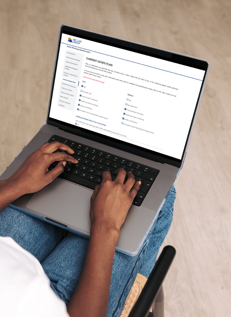 Person using a laptop showing an estate planning checklist form.