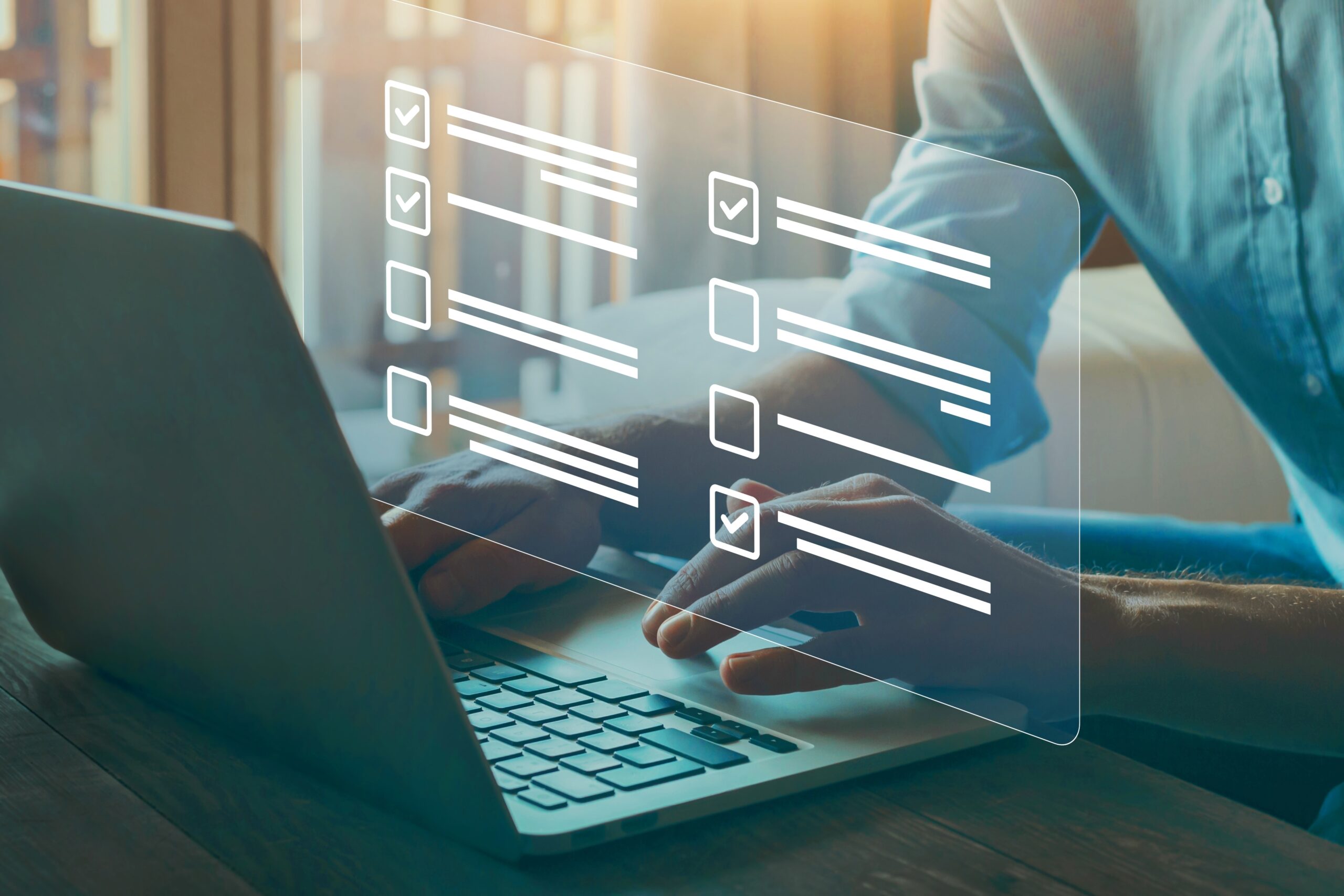 Person typing on a laptop with digital checklist graphics overlaid.